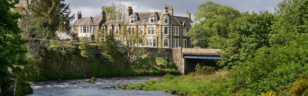 A view of the Ulbster Arms Hotel in Caithness from the river in front of it