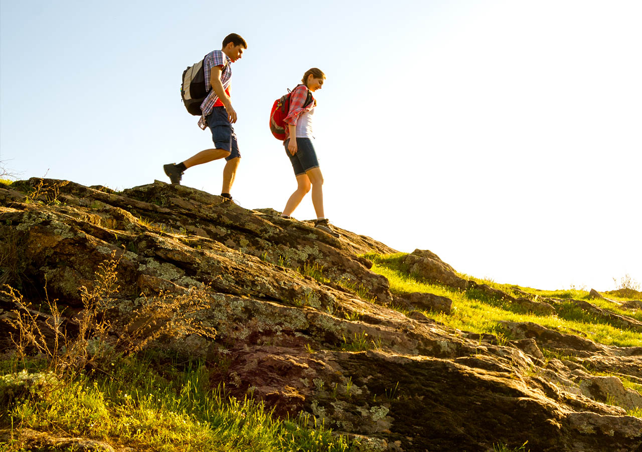A couple hiking in the summer
