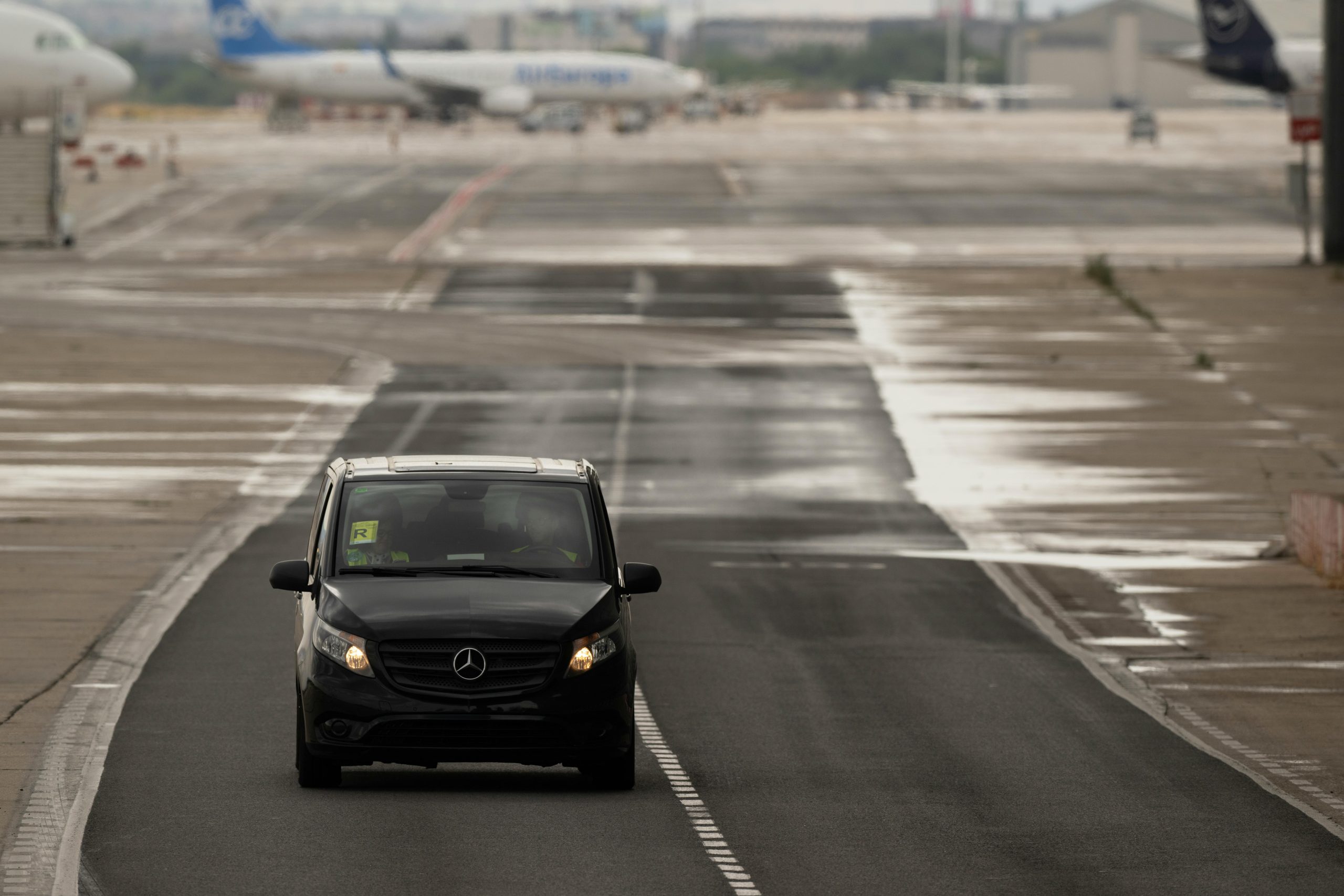 Blacked out large car travelling from an airport