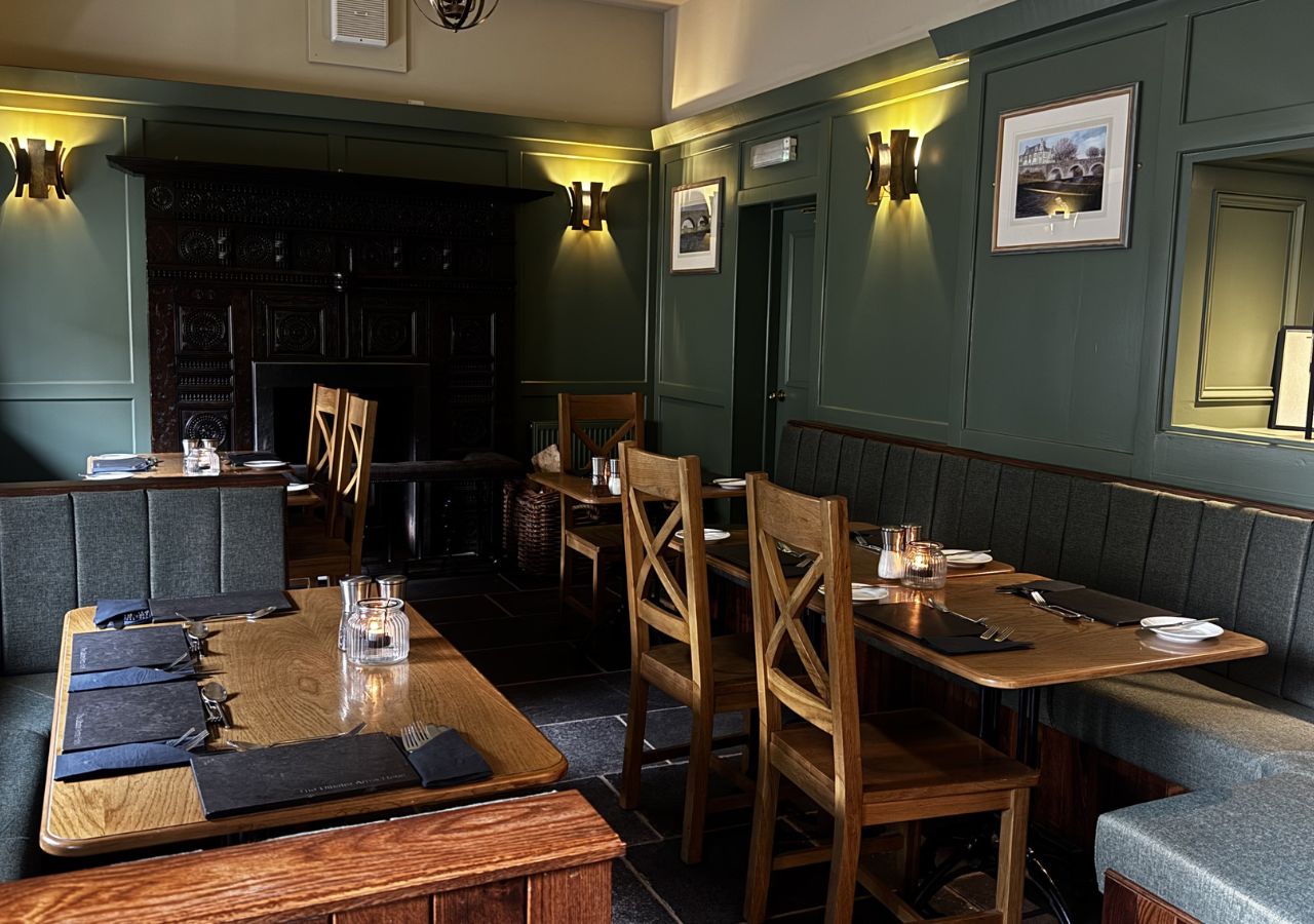 Table and chairs at Ulbster Arms Hotel renovated bar